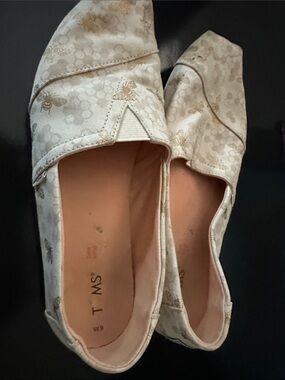 Toms Cream Slip-On Flats with Gold Bee Accents